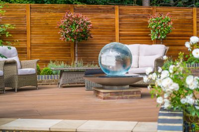 Aqualens Sphere Fountain on raised surface.